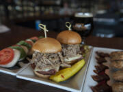 The Caprese salad is served with Cuban sliders and bacon chocolate chip cookies.