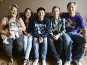 Mary, from left, McKenna, Matt, Adam and Steve Pozsgai, sit together in their Salmon Creek home. Matt, 21, has cystic fibrosis and struggles daily to maintain his health. His sister, McKenna, 16, recently was selected by Cystic Fibrosis Foundation to advocate to lawmakers in Washington, D.C., about improving research and funding for cystic fibrosis.