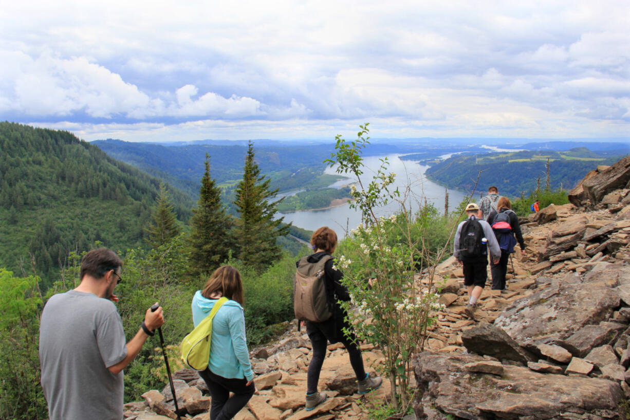 Hikers head down the trail after reaching the top on a recent Saturday morning in the Columbia River Gorge.