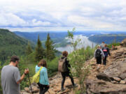 Hikers head down the trail after reaching the top on a recent Saturday morning in the Columbia River Gorge.