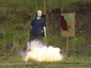 A mannequin is used to show the damage fireworks can cause during a demonstration hosted by the Vancouver Fire Department, ATF and the fireworks industry at Camp Bonneville, Monday, June 16, 2014.