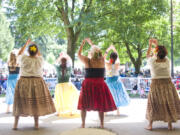 Dancers show off their skills at a performance during the Ho'ike and Hawaiian Festival in Esther Short Park in Vancouver.