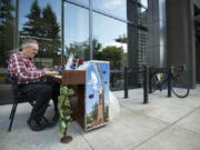 There&#039;s nothing like a little sidewalk sound. In this file photo from 2012, musician Dezy Walls avails himself of a public piano in front of Vancouver City Hall. This year, the School of Piano Technology for the Blind will place 16 decorated pianos around Clark County and Portland during its Keys to The City event Aug.