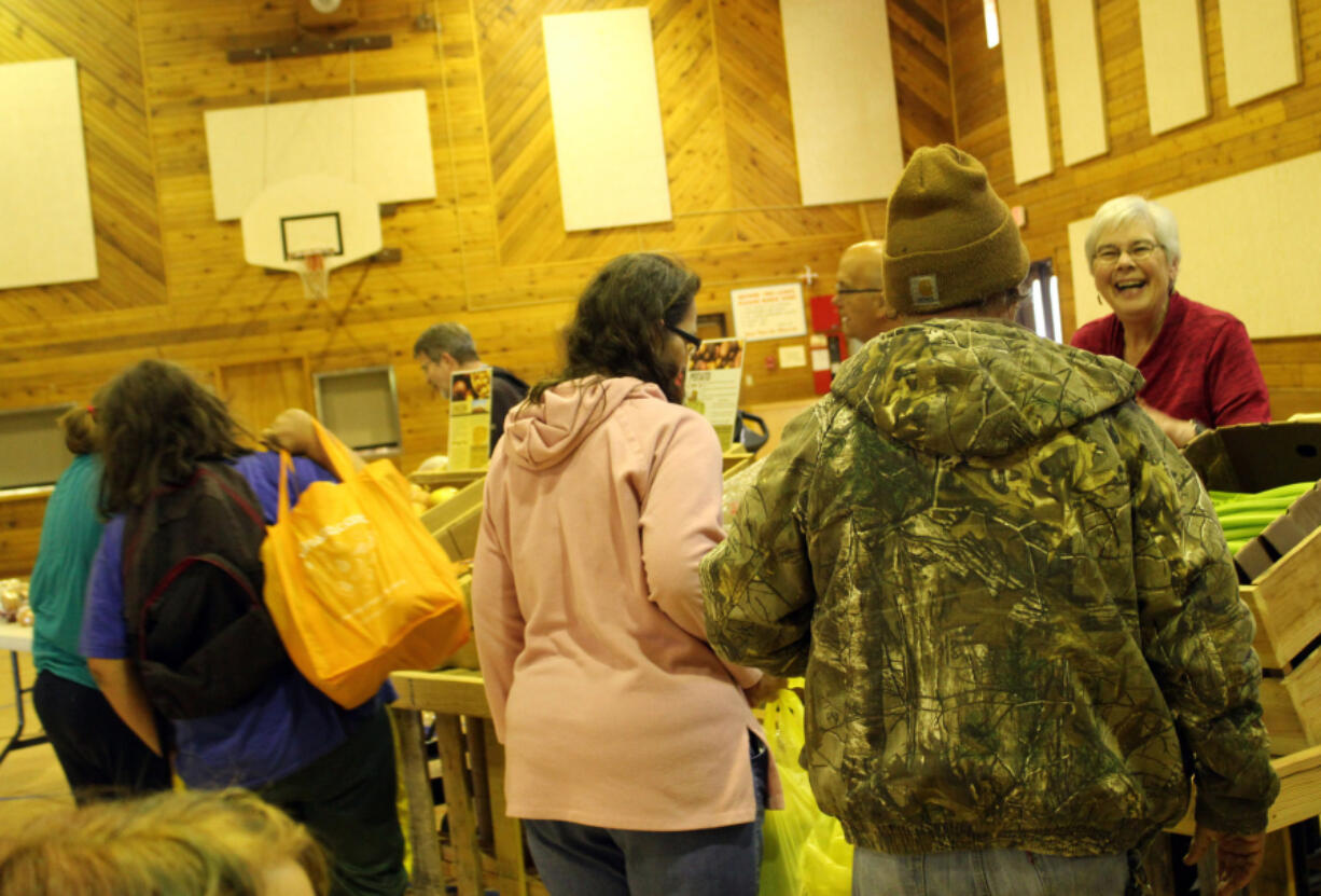 Hazel Dell North: Customers file through the offerings at St.