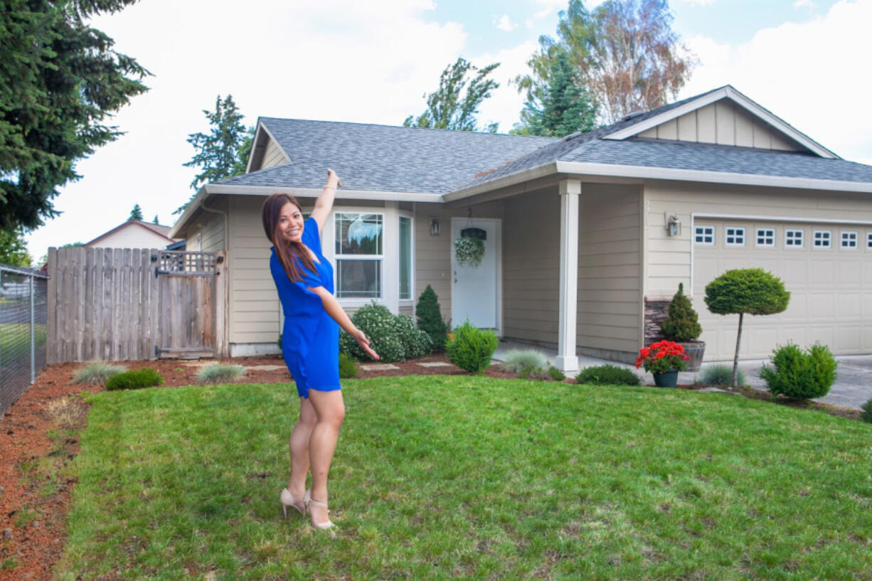 Five Corners: Jacqy Lopez with her new home, which she was able to buy thanks to help from Portland-based nonprofit Proud Ground and HomeStreet Bank.