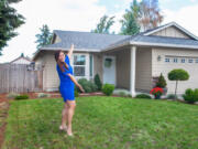 Five Corners: Jacqy Lopez with her new home, which she was able to buy thanks to help from Portland-based nonprofit Proud Ground and HomeStreet Bank.