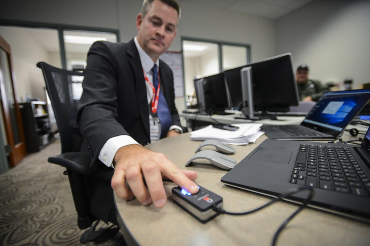 A scanner recognizes the fingerprint of Justin Davis. Davis&#039; company, Executive Information Systems, sold the county the new biometric technology being implemented at the Clark County Jail.