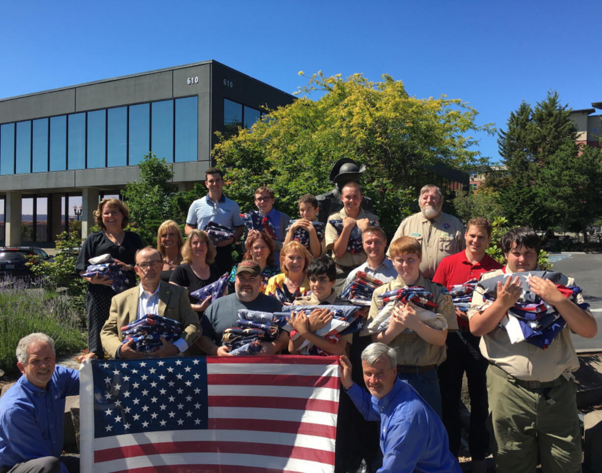 Esther Short: Members of the Davidson &amp; Associates Insurance Agency collected more than 230 old American flags, which the Fort Vancouver District Boy Scouts of America then retired in a proper ceremony.