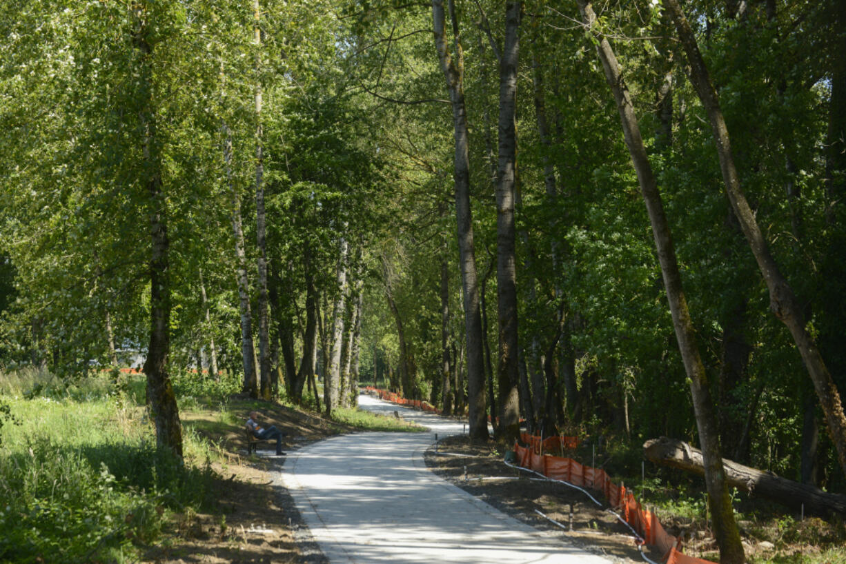 Construction takes place along a waterfront trail near the Port of Camas-Washougal, where the port is opening a large park and trail along the waterfront in the fall.