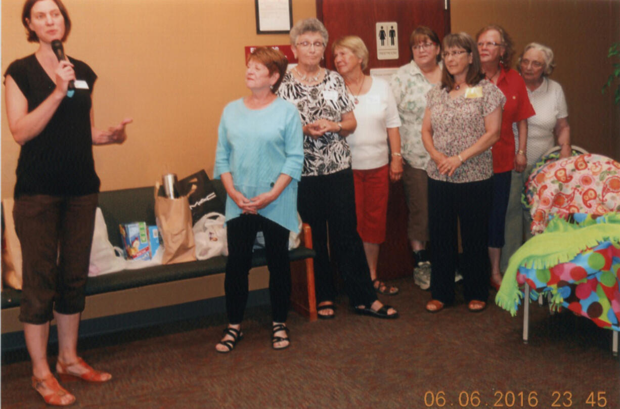 Shumway: Members of the Clark County Newcomers Club present blankets to the YWCA SafeChoice Domestic Violence Program.