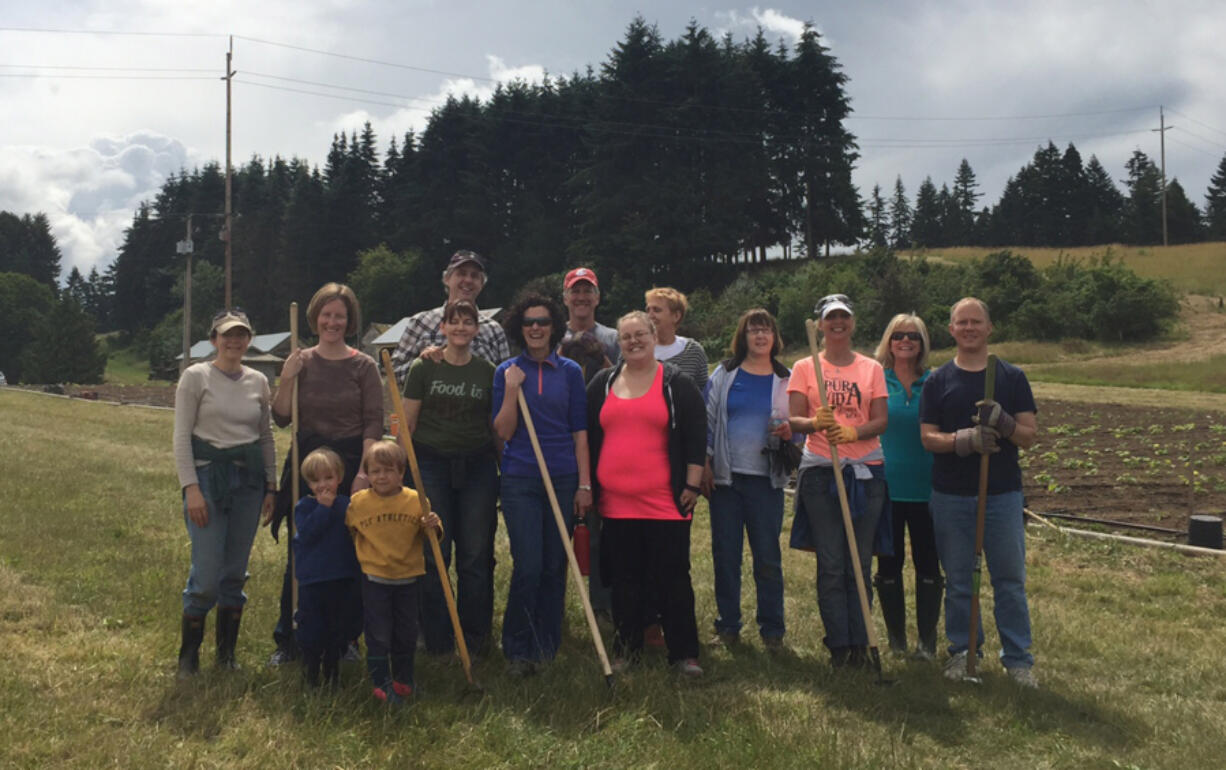 Volunteers from the Washington State Department of Transportation at the 78th Street Heritage Farm, where they harvested vegetables for the Clark County Food Bank.