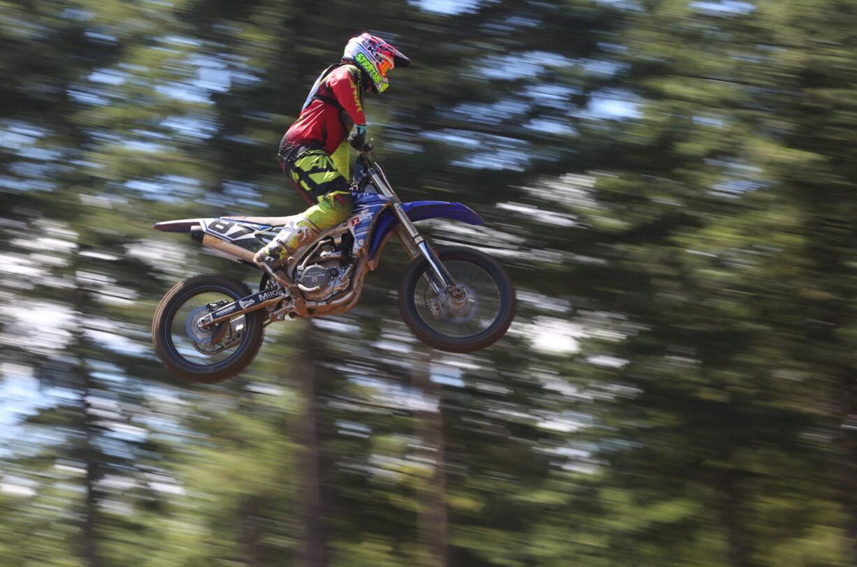 Austin Politelli of Menifee, Calif., flies through the air as he takes part in the 450cc race in the Washougal MX National in Washougal Saturday July 23, 2016.