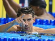 Michael Phelps reacts after winning the men's 100-meter butterfly finals at the U.S. Olympic swimming trials, in Omaha, Neb., Saturday, July 2, 2016.