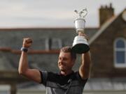 Henrik Stenson of Sweden poses with the trophy after winning the British Open Golf Championships at the Royal Troon Golf Club in Troon, Scotland, Sunday, July 17, 2016.