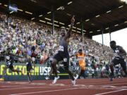 Justin Gatlin reacts after winning the during for men's 100-meter final at the U.S. Olympic Track and Field Trials, Sunday, July 3, 2016, in Eugene Ore.