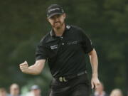 Jimmy Walker reacts to his birdie putt on the 11th hole during the final round of the PGA Championship golf tournament at Baltusrol Golf Club in Springfield, N.J., Sunday, July 31, 2016.