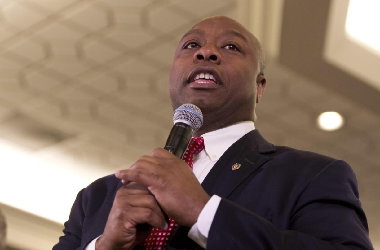 Sen. Tim Scott, R-S.C., talks with reporters on Capitol Hill in Washington.