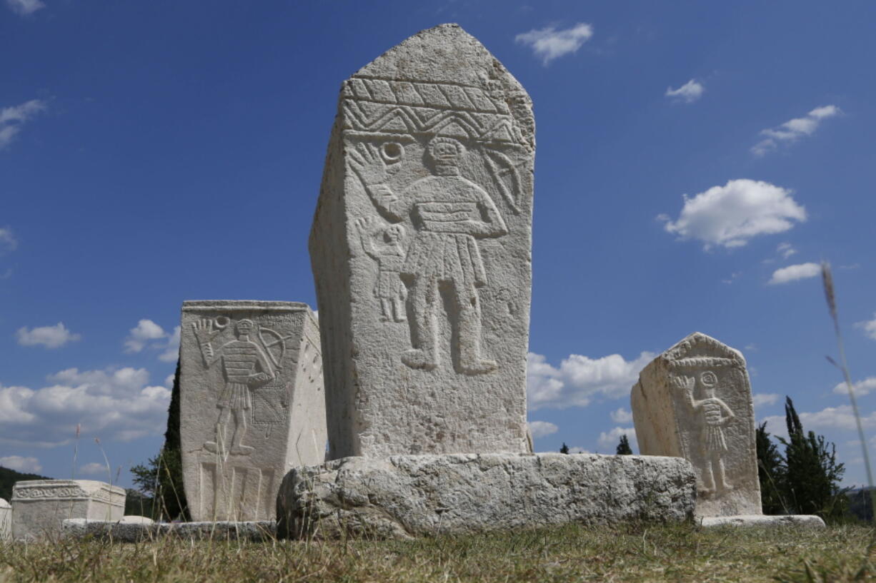 This photo taken on Monday, July 18, 2016, shows Bosnian medieval tombstones near the southern Bosnian town of Stolac, 200km south of Sarajevo, Bosnia. Necropolis in Stolac was built at the end of the 14th century, and its 135 tombstones, shaped like coffins, depict mostly men showing the medieval Bosnian hand salute. The tombstones, also known as Stecci, have been officially placed on UNESCO&#039;s world heritage list.