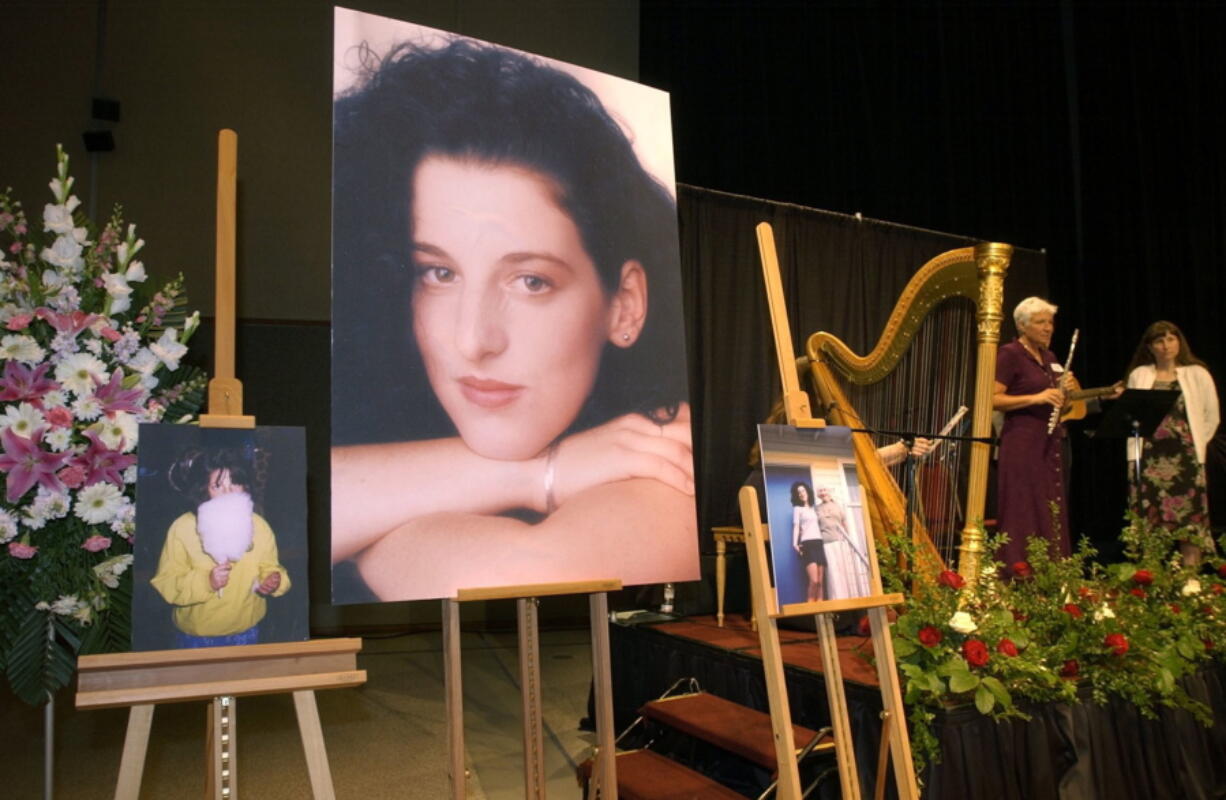 FILE - In this May 28, 2002 pool-file photo taken at the Modesto Centre Plaza in Modesto, Calif., photos of Chandra Levy are on display May 28, 2002, as musicians, right, stand by at the memorial service for Levy at the Modesto Centre Plaza in Modesto, Calif. The U.S. Attorney&#039;s office said in a statement Thursday that the office has moved to dismiss the case charging Ingmar Guandique with Levy&#039;s 2001 murder. According to the statement, prosecutors concluded they could not convict Guandique &quot;based on recent unforeseen developments that were investigated over the past week.&quot; The statement does not elaborate.