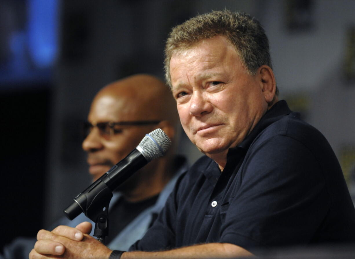 Actor William Shatner, right, answers a question during a panel for the movie &quot;The Captains&quot; at the Comic-Con International 2011 convention in San Diego. Wonder Woman, &quot;Star Trek&quot; and &quot;Aliens&quot; are among the long-running entertainment franchises that will celebrate milestones at this week&#039;s San Diego Comic-Con.