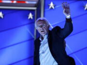 Sen. Bernie Sanders, I-Vt., waves as he walks off the stage after checking out the podium before the start of the first day of the Democratic National Convention in Philadelphia on Monday.