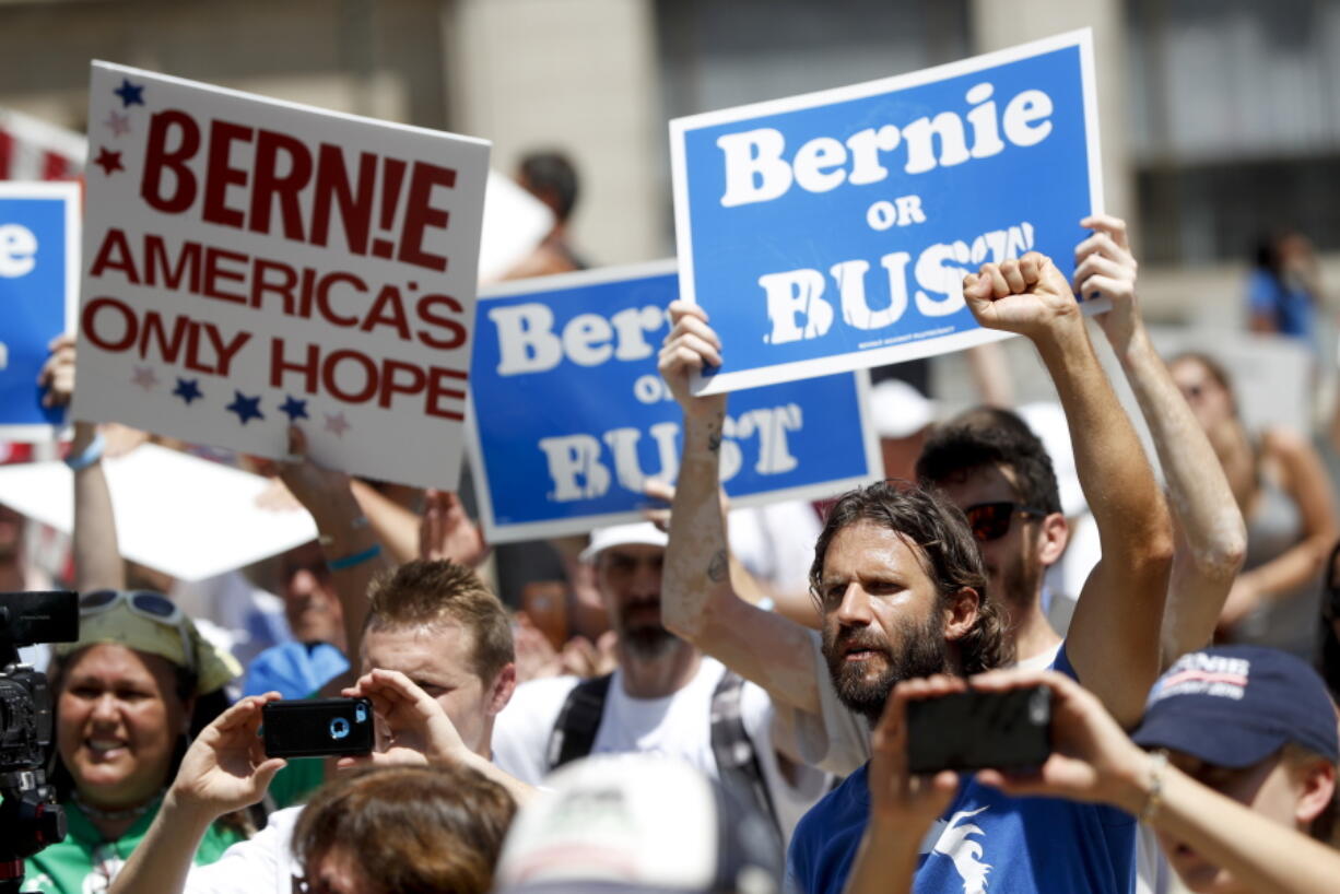 A supporters of Sen. Bernie Sanders, I-Vt., listens during a rally in Philadelphia on Tuesday during the second day of the Democratic National Convention.