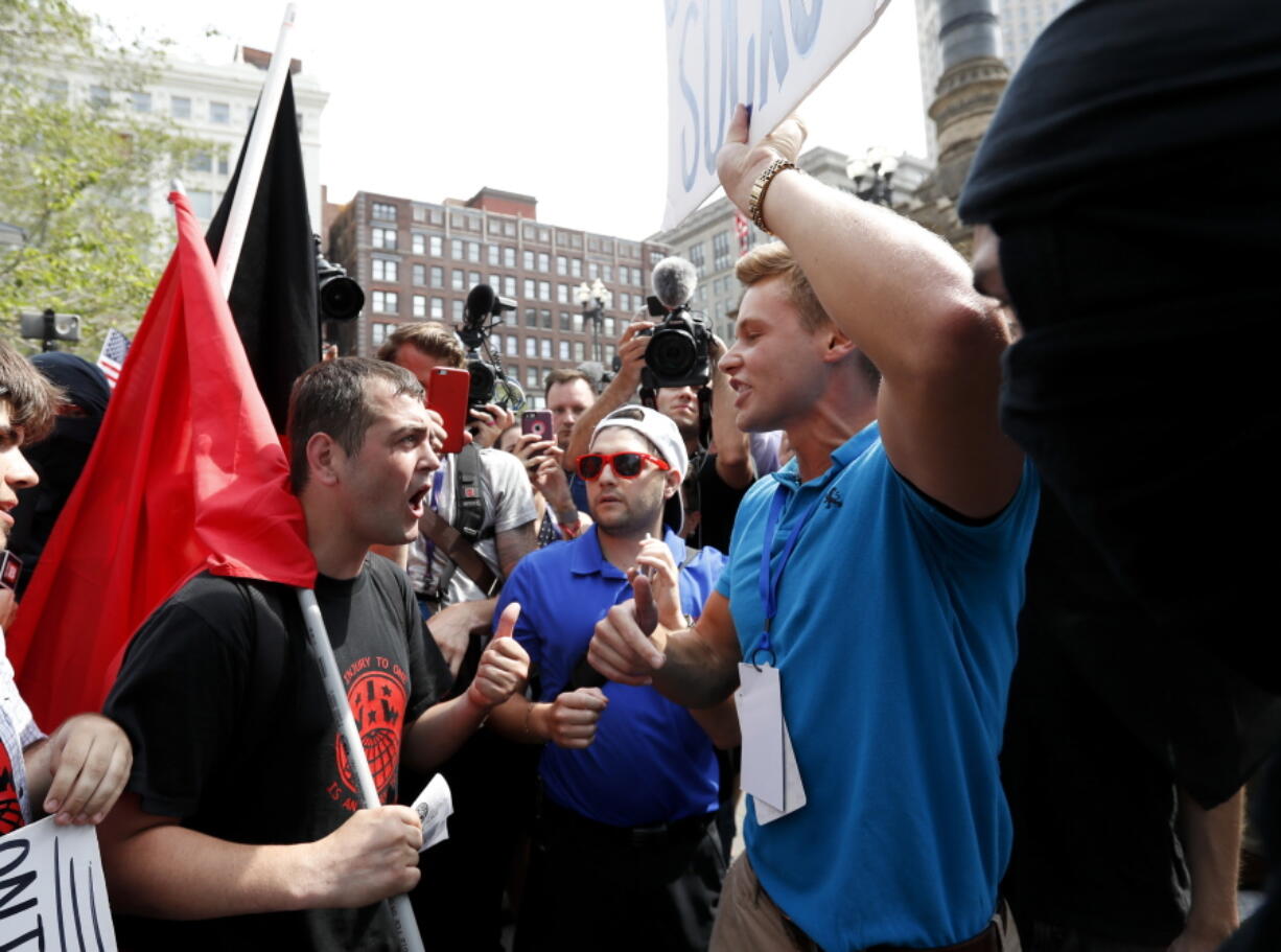 Protesters argue in Public Square on Thursday in Cleveland, during the final day of the Republican convention.