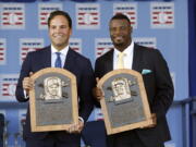 National Baseball Hall of Fame inductees Mike Piazza, left, and Ken Griffey Jr. hold their plaques after an induction ceremony at the Clark Sports Center on Sunday, July 24, 2016, in Cooperstown, N.Y.