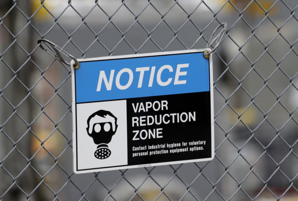 A sign stating efforts to reduce exposure to vapors is posted in 2014 at Hanford Nuclear Reservation near Richland. A contractor is proposing some reforms to protect workers. (Ted S.