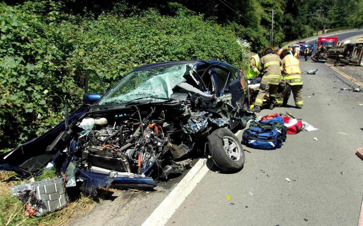 This photo taken Monday, July 4, 2016, and provided by the Oregon State Police shows the scene of a crash on Highway 101 near Lincoln City, Ore. Logan Kitzhaber, the 18-year-old son of former Oregon Gov. John Kitzhaber, was critically injured in the crash and flown to OHSU Hospital in Portland, Ore.