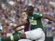 Portland Timbers forward Fanendo Adi, front, hooks a shot past Colorado Rapids defender Axel Sjoberg in the first half of an MLS soccer match Monday, July 4, 2016, in Commerce City, Colo.