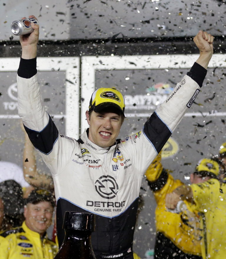 Brad Keselowski celebrates in Victory Lane after winning the NASCAR Sprint Cup Series auto race at Daytona International Speedway, Saturday, July 2, 2016, in Daytona Beach, Fla.