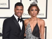 Seattle Seahawks quarterback Russell Wilson, left, and singer Ciara arrive Feb. 15 at the 58th annual Grammy Awards in Los Angeles. The couple were married Wednesday at Peckforton Castle in Cheshire, England.