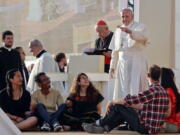 Pope Francis blesses youths ahead of a prayer vigil on the occasion of the World Youth Days, in Campus Misericordiae in Brzegi, near Krakow, Poland, Saturday. The 79-year-old Francis has had an unrelenting schedule since he arrived in Poland on Wednesday for World Youth Days, a global Catholic gathering which culminates Sunday.