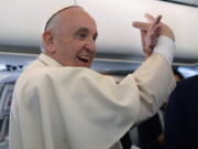 Pope Francis meets reporters during his flight to Poland on Wednesday to start a 5-day visit. Pope commented on French priest&#039;s slaying, saying the world&#039;s at war, but it&#039;s not a &#039;war of religions&#039;.