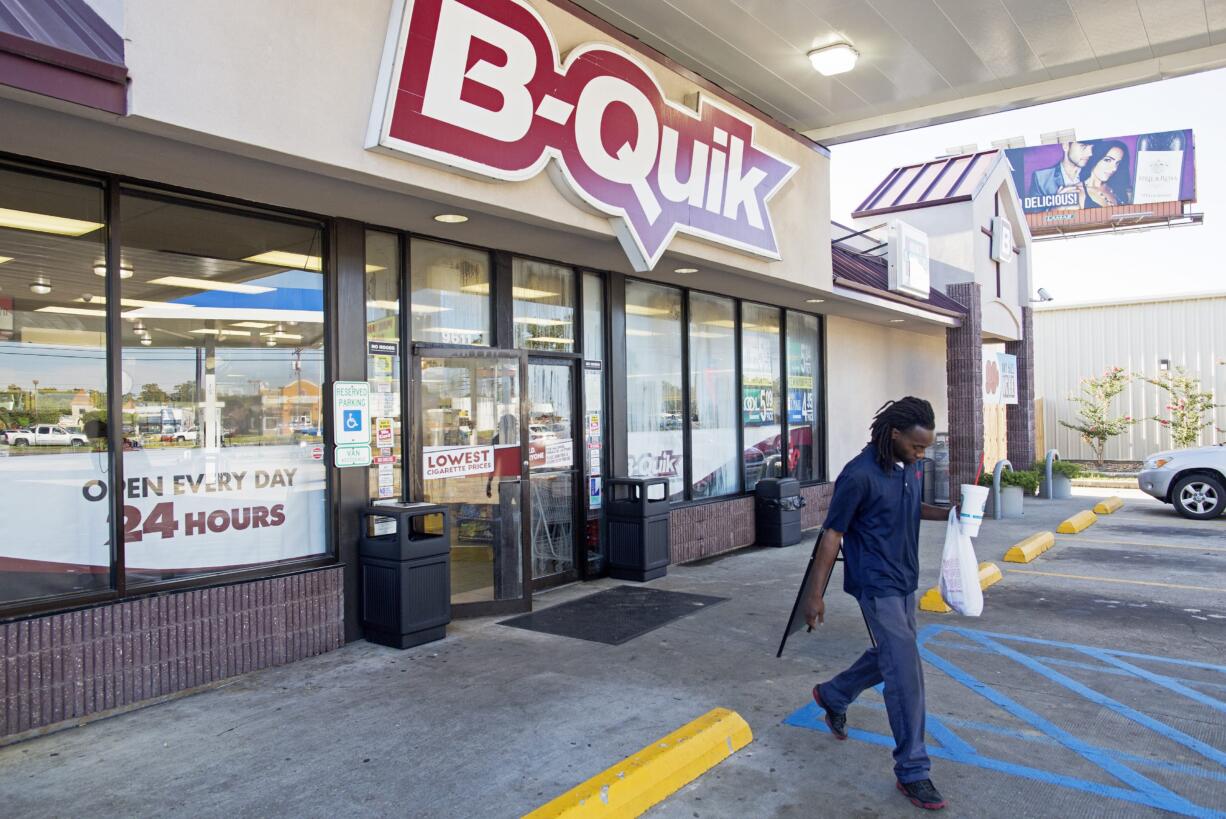 The B-Quick convenience store on Airline Highway where an encounter with a shooter left three law enforcement officers dead on Sunday is open for business in Baton Rouge, La., Monday, July 18, 2016. Several memorials are planned in Baton Rouge to honor the fallen law enforcement officers.