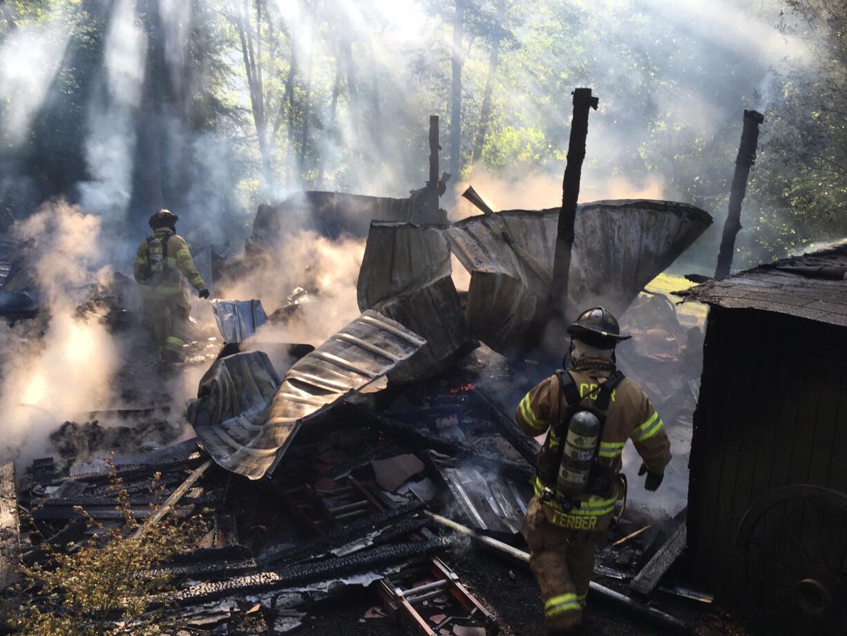 Fire destroyed a barn an damaged an outbuilding Thursday evening at 1804 N.W. 310th St. in Ridgefield, but firefighters stopped the fire’s advance before it could reach the property owners' house.