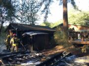 Fire destroyed a barn an damaged an outbuilding Thursday evening at 1804 N.W. 310th St. in Ridgefield, but firefighters stopped the fire’s advance before it could reach the property owners' house.