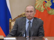 Russian President Vladimir Putin chairs a meeting of Russia&#039;s cabinet in the Kremlin in Moscow, Russia, Friday.