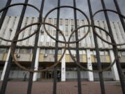 People walk in front of the Russian Olympic Committee building in Moscow.