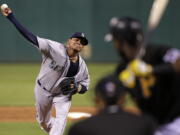 Seattle Mariners starting pitcher Felix Hernandez delivers during the fifth inning of a baseball game against the Pittsburgh Pirates in Pittsburgh, (Gene J.