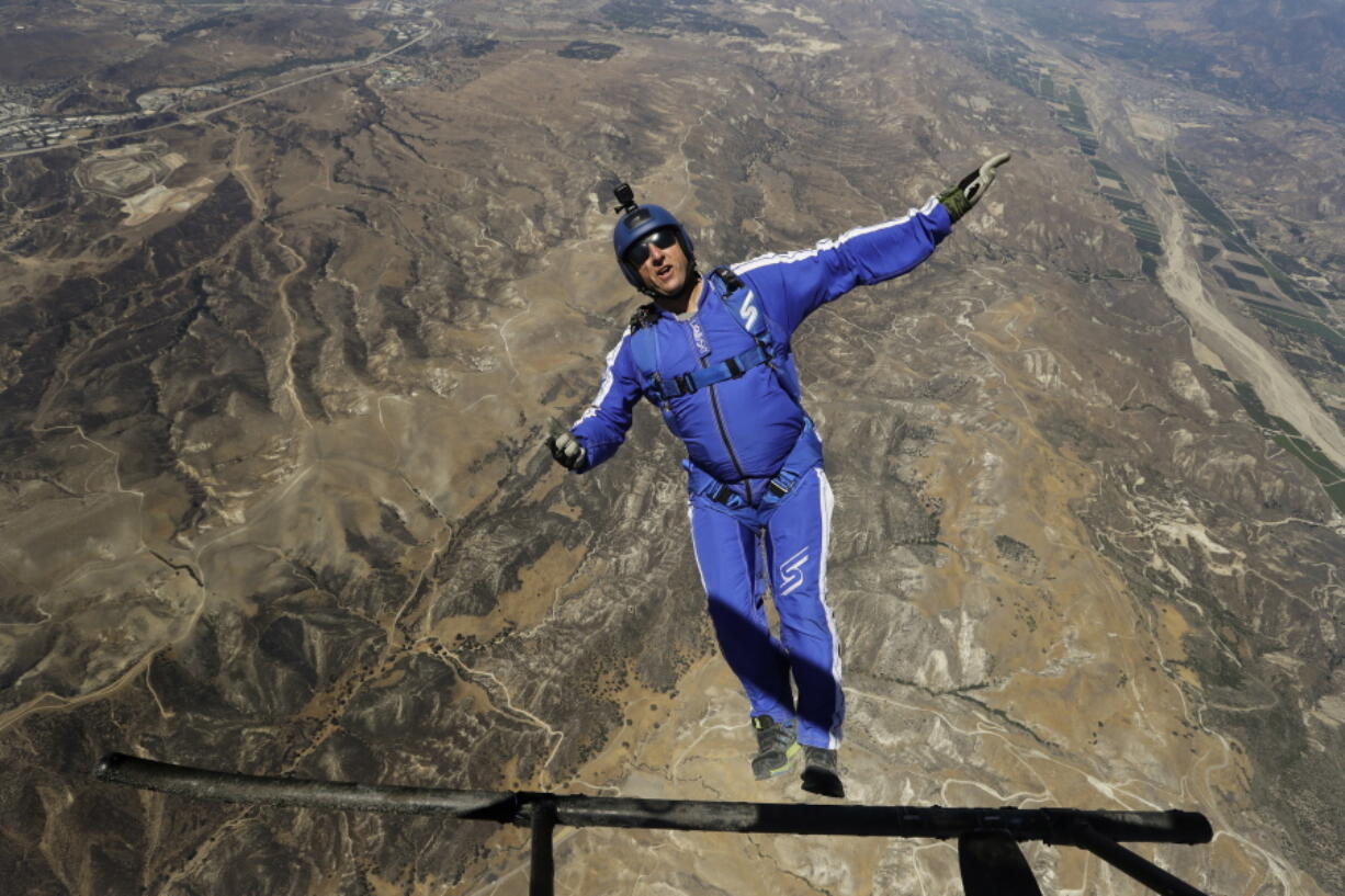 Skydiver Luke Aikins jumps from a helicopter  Mondaduring his training in Simi Valley, Calif. After months of training, this elite skydiver says he&#039;s ready to leave his chute in the plane when he bails out 25,000 feet above Simi Valley on Saturday. That&#039;s right, no parachute, no wingsuit and no fellow skydiver with an extra one to hand him in mid-air. (AP Photo/Jae C.