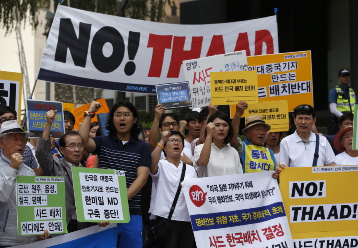 South Koreans shout slogans Monday during a rally to denounce deploying the Terminal High-Altitude Area Defense, or THAAD, near U.S. Embassy in Seoul, South Korea. Seoul and Washington launched formal talks on deploying the Terminal High-Altitude Area Defense, or THAAD, after North Korea conducted a nuclear test and a long-range rocket launch earlier this year. China, Russia and North Korea all say the THAAD deployment could help U.S. radars spot missiles in their countries.