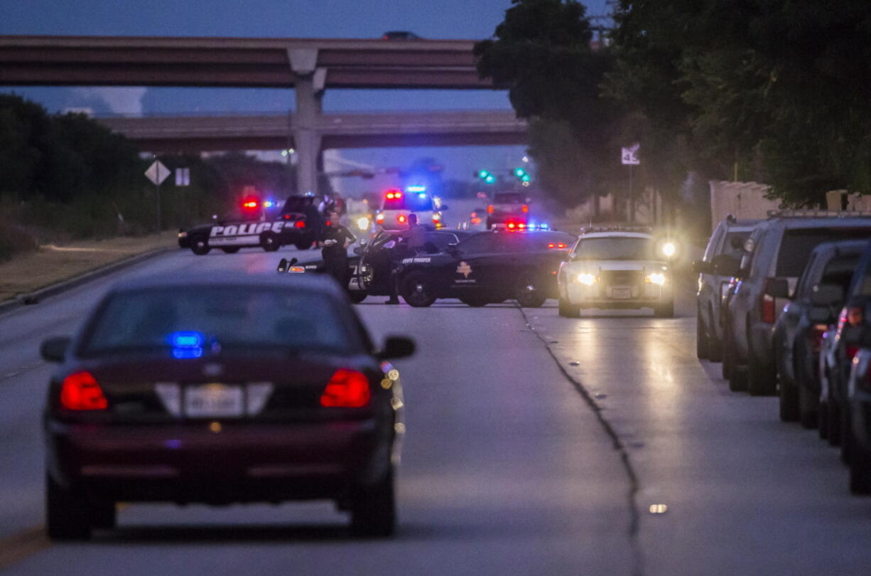 Law enforcement officers from multiple Central Texas agencies respond to reports of an officer down in Round Rock, Texas, on Monday. A Texas sheriff&#039;s deputy was shot and killed at his home north of Austin before dawn on Monday in what authorities said appeared to be an attempted burglary. (Ricardo B.