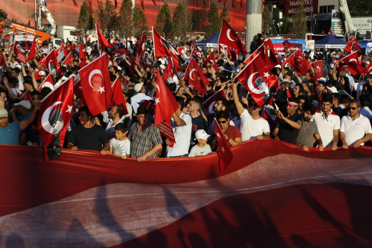 Supporters of the Republican People&#039;s Party, or CHP, wave Turkish flags during a &#039;Republic and Democracy Rally&#039; at Taksim square in central Istanbul, on Sunday. Thousands of supporters of Turkey&#039;s main opposition group and some ruling party members rallied in Istanbul to denounce a July 15 coup attempt, a rare show of political unity that belied opposition unease over President Recep Tayyip Erdogan&#039;s crackdown since the failed uprising.