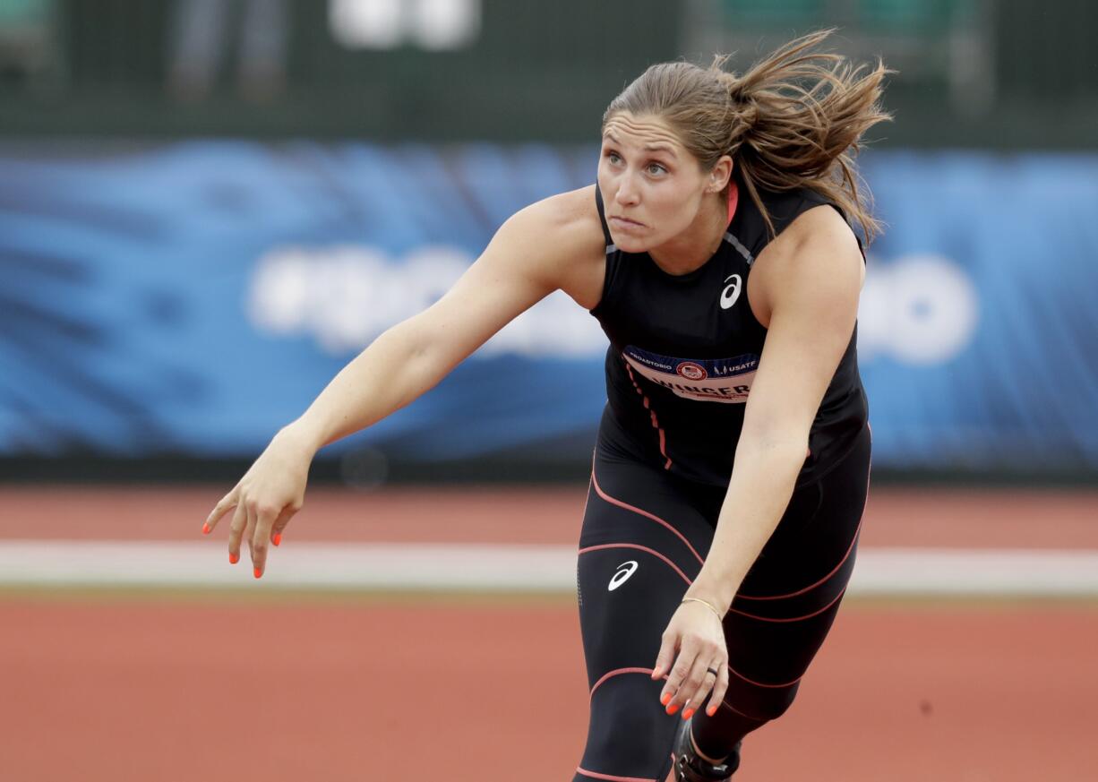 Kara Winger watches her throw during qualifying for the women's javelin at the U.S. Olympic Track and Field Trials, Thursday, July 7, 2016, in Eugene Ore.