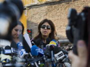 Italian communications expert Francesca Chaouqui talks to journalists on Thursday after a Vatican court convicted her and a Vatican monsignor for having conspired to pass documents to two Italian journalist. The court also declared it had no jurisdiction to prosecute two journalists for having published the confidential information and asserted the Vatican guarantees the freedom of the press.