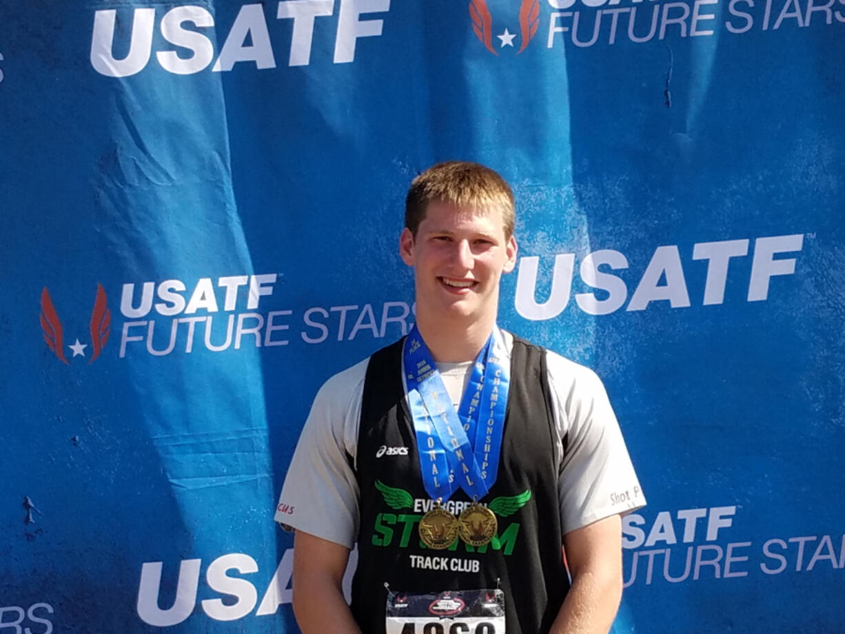 Trey Knight of Ridgefield wears two gold medals he won at the Junior Olympics last weekend in Sacramento, Calif.