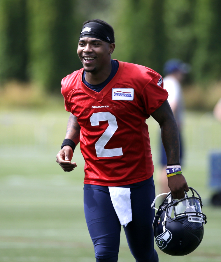 Seattle Seahawks&#039; Trevone Boykin smiles as he heads off the field after the team&#039;s NFL football training camp Saturday, July 30, 2016, in Renton, Wash.