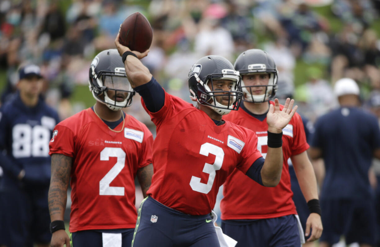 Seattle Seahawks quarterback Russell Wilson throws during the team&#039;s NFL football training camp Saturday, July 30, 2016, in Renton, Wash.